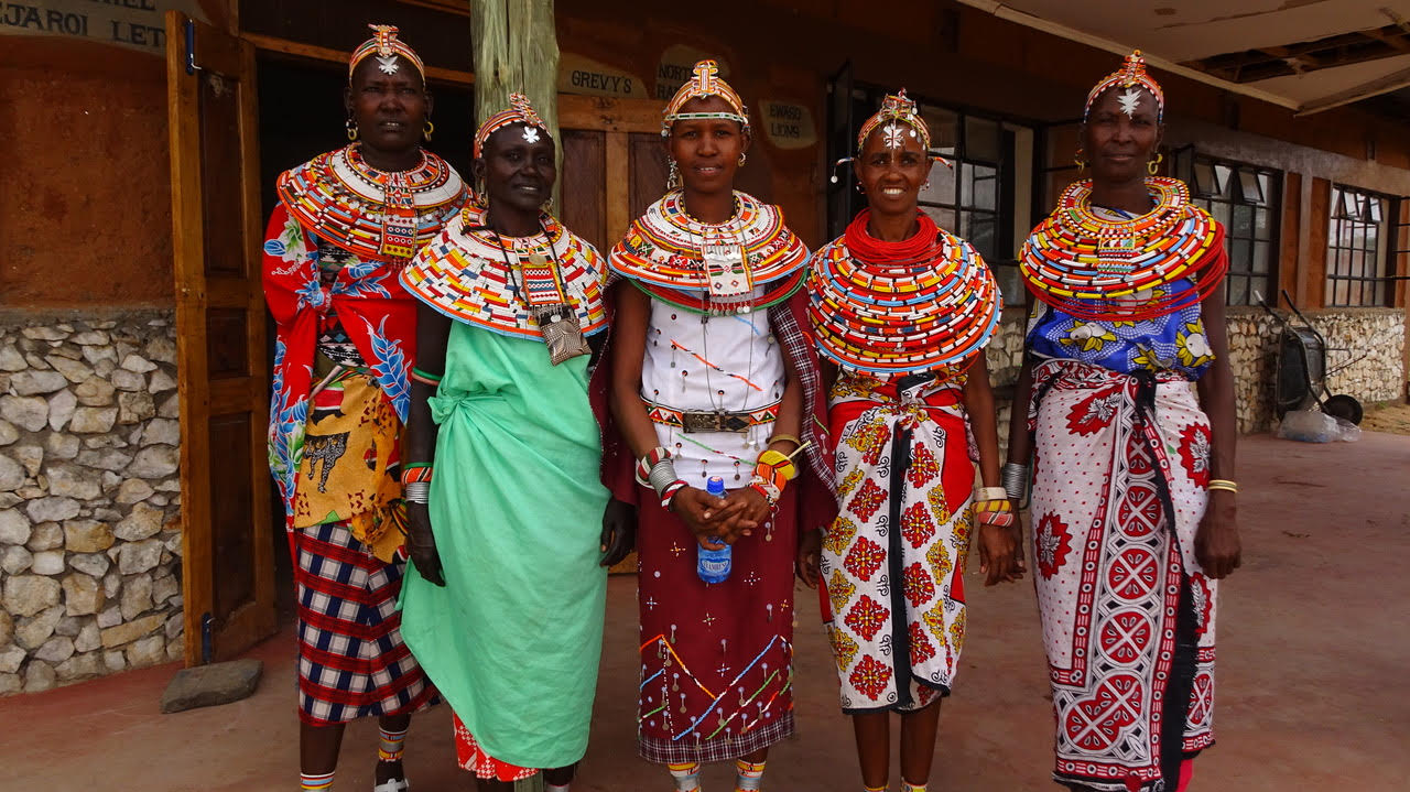A group of women in traditional dress at an MSWC training session