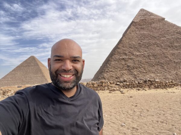 Rob Vember standing at the Pyramids of Giza, December 2024.